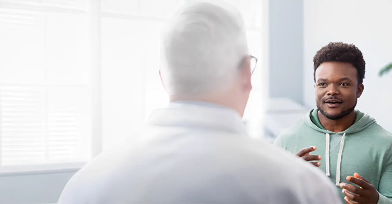 Chris discussing WAKIX and symptoms with his healthcare provider