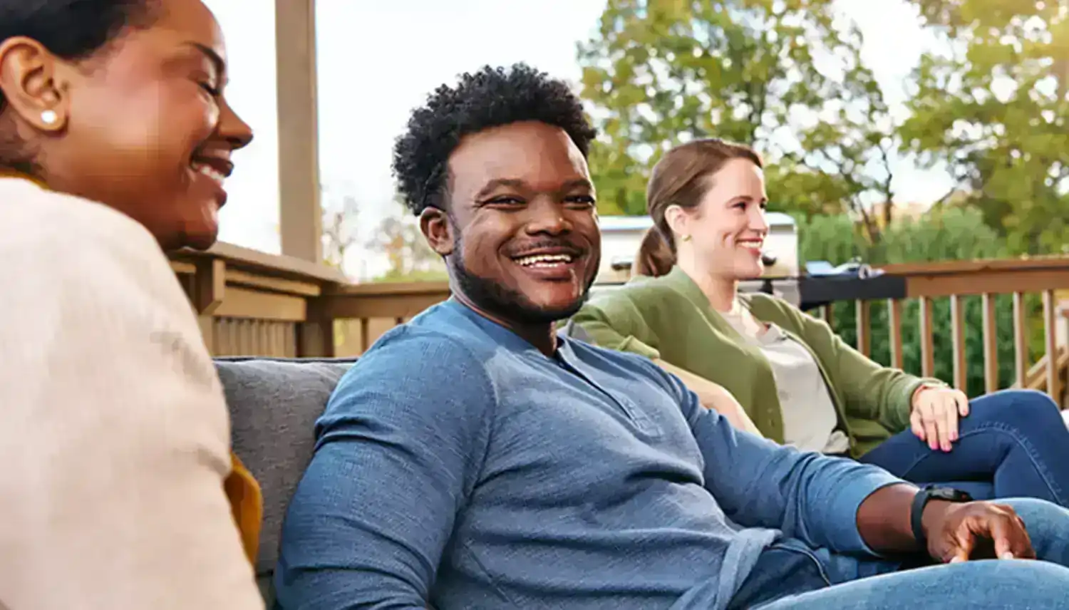 Chris, a real person with narcolepsy with cataplexy taking WAKIX, sitting with friends